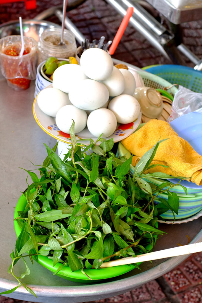 A street food vendor sells balut in Vietnam