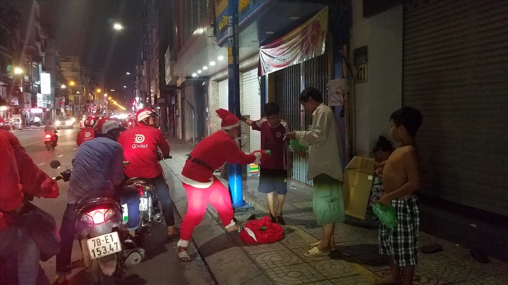 Offering gifts to homeless people during Christmas in Vietnam