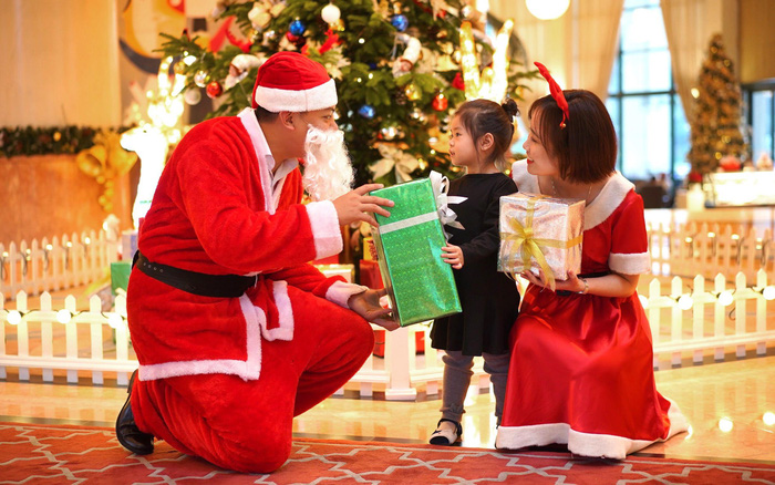 Santa Claus gives Christmas gift to a child